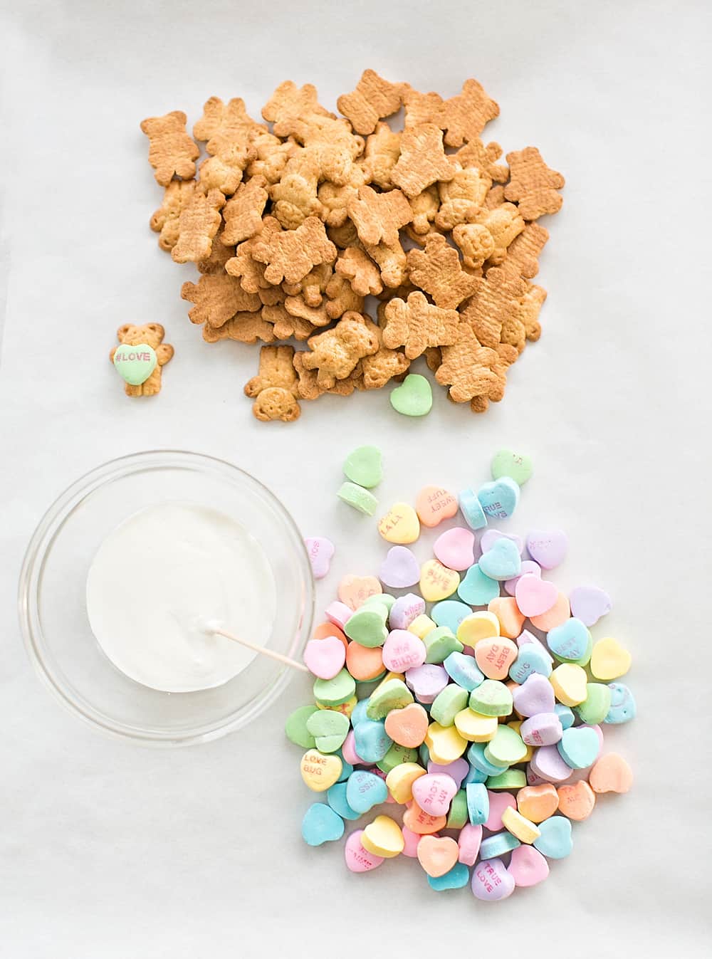 These Adorable Bear Holding Heart Cookies make a an cute and easy Valentine treat for kids or school lunch snack they can make themselves.