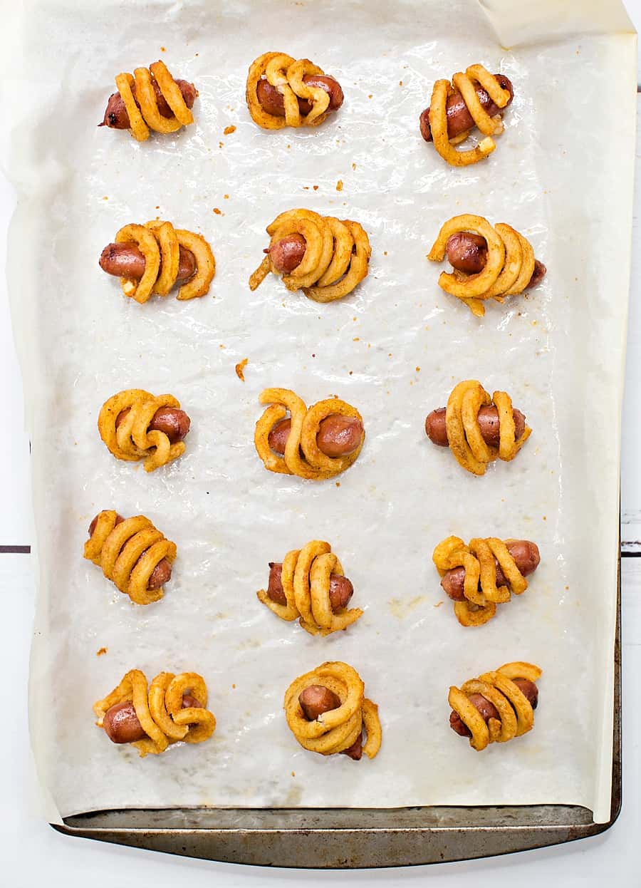 Combine two favorite iconic foods into one yummy bite-sized lunch or dinner for kids with these curly fries mini hot dogs. 