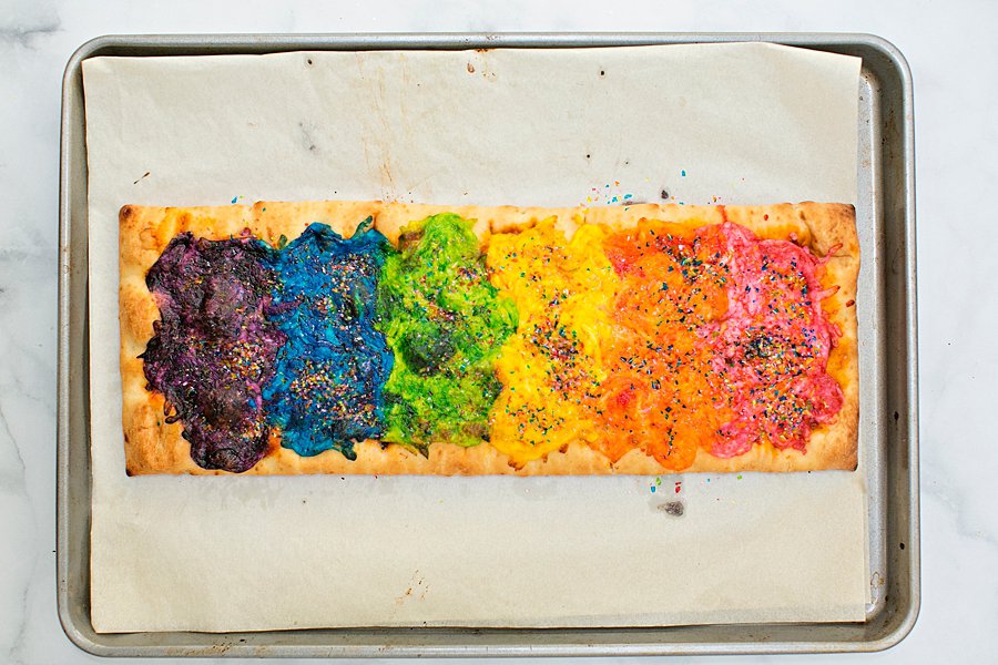 Our Rainbow Glitter Unicorn Pizza is the (easiest!) most magical pizza you'll ever eat. This stunning snack will be the healthy hightight of your party!