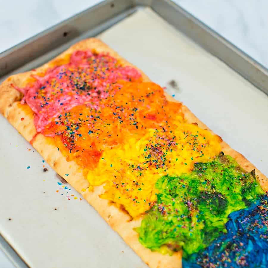 Our Rainbow Glitter Unicorn Pizza is the (easiest!) most magical pizza you'll ever eat. This stunning snack will be the healthy hightight of your party!