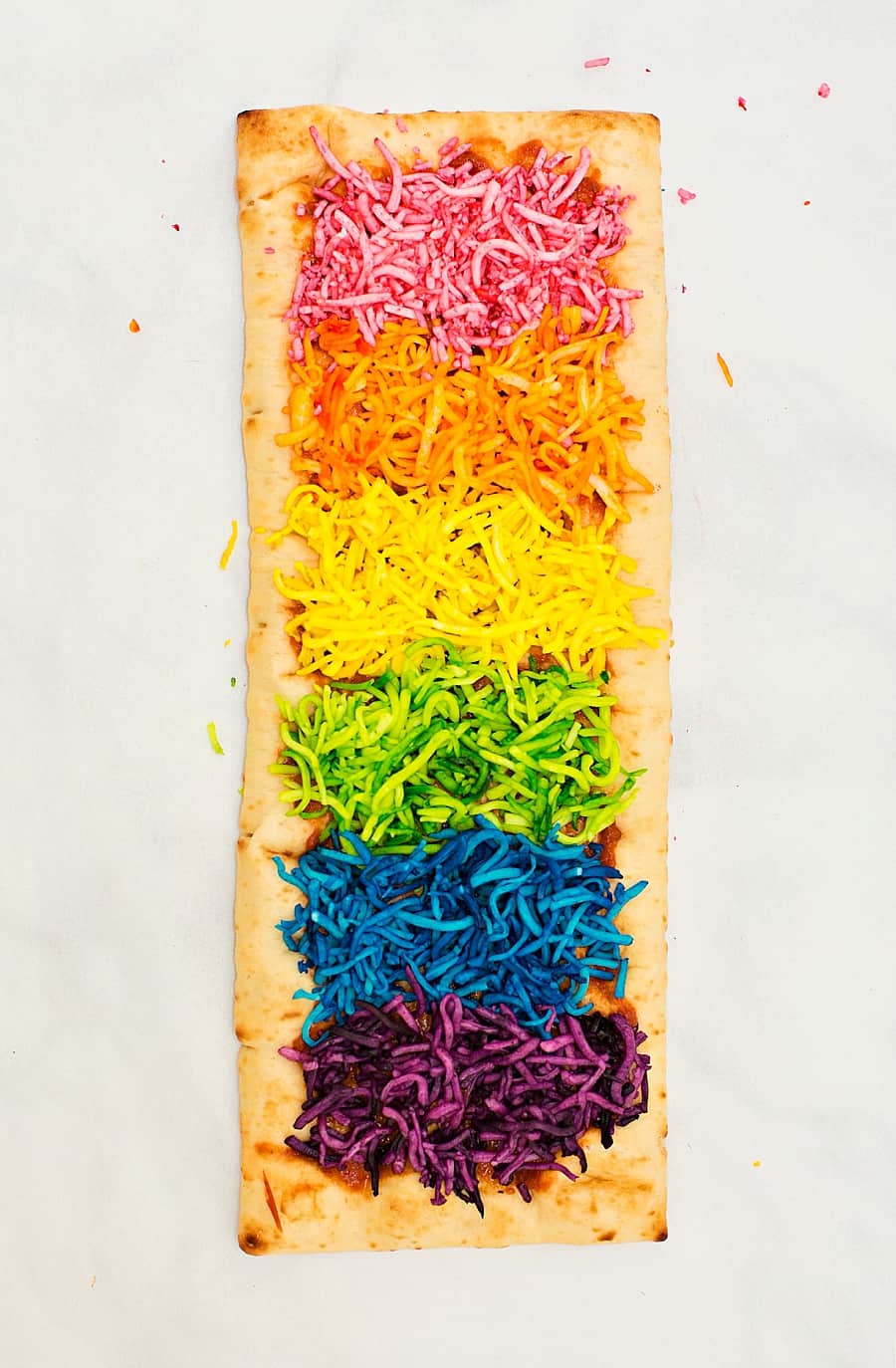 Our Rainbow Glitter Unicorn Pizza is the (easiest!) most magical pizza you'll ever eat. This stunning snack will be the healthy hightight of your party!