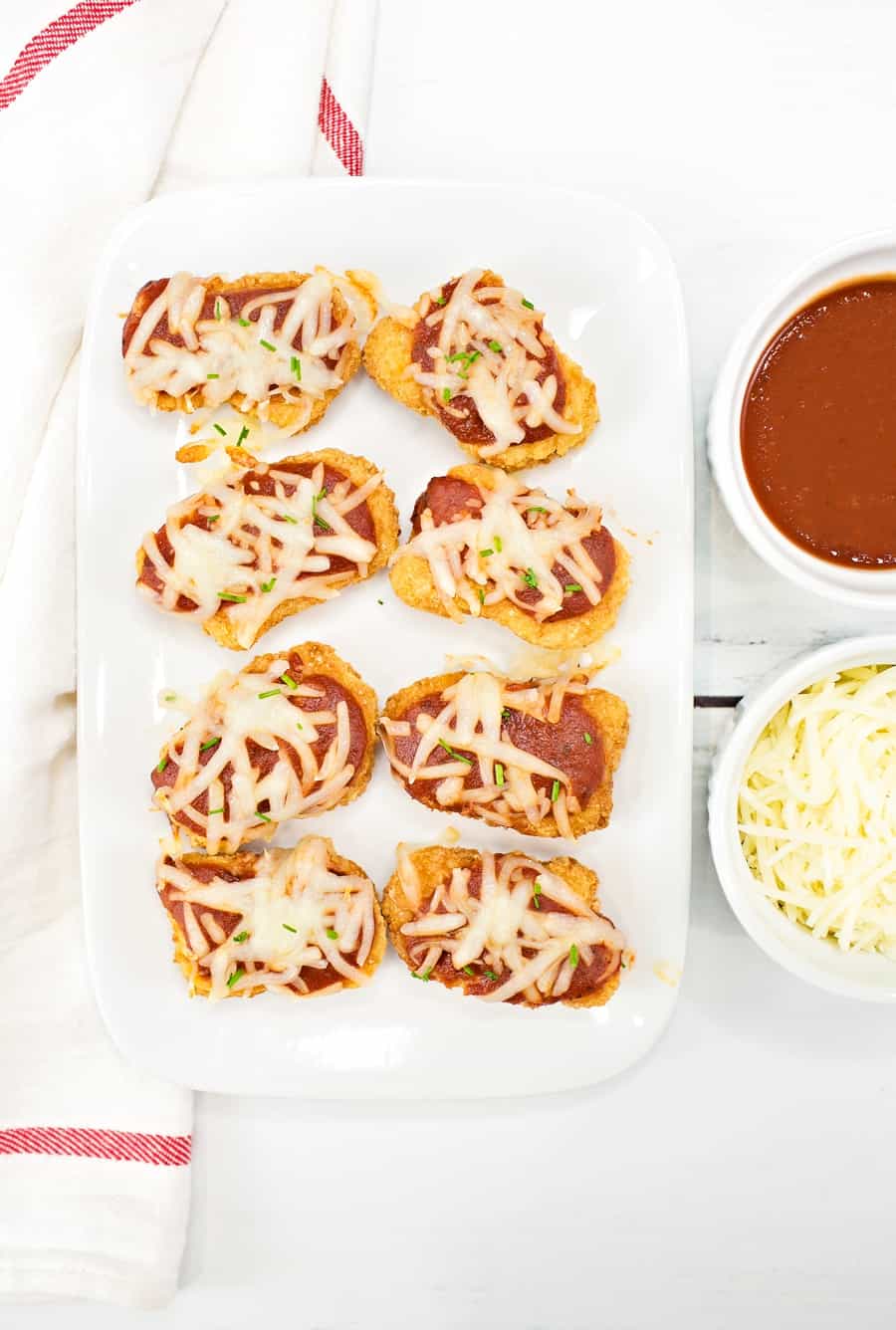 Serve up these crowd-pleasing easy chicken parmesan bites for a lunch or dinner that will get two-thumbs up from the whole family. 