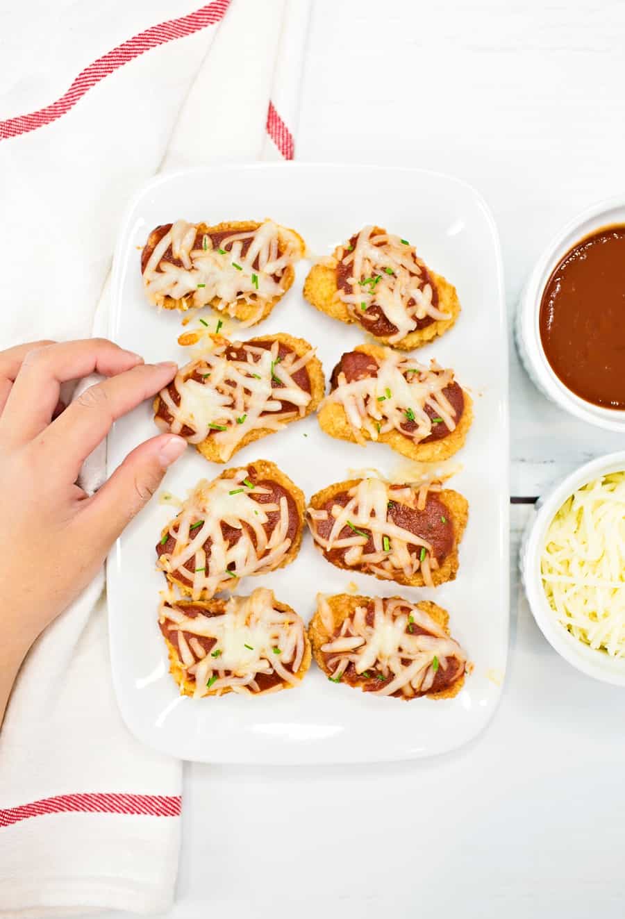 Serve up these crowd-pleasing easy chicken parmesan bites for a lunch or dinner that will get two-thumbs up from the whole family. 