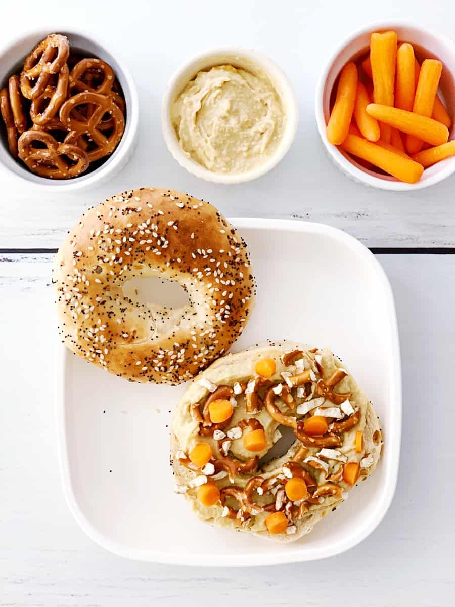 This Carrot Hummus Pretzel Bagel Sandwich is a hearty kids meal thatl combines a favorite flavor combination into one tasty and savory sandwich!