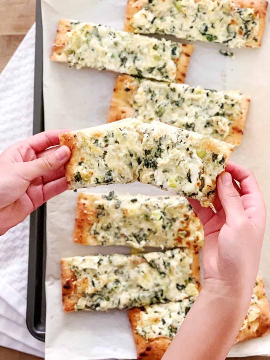 Turn your favorite dip into Spinach Artichoke Dip Pizza for a yummy dinner kids and adults will love! Pre-made crust makes this an easy weeknight meal!