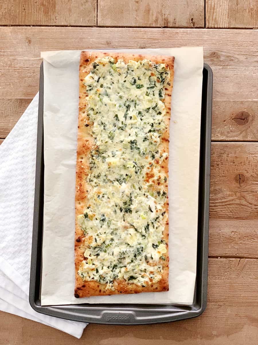 Turn your favorite dip into Spinach Artichoke Dip Pizza for a yummy dinner kids and adults will love! Pre-made crust makes this an easy weeknight meal!