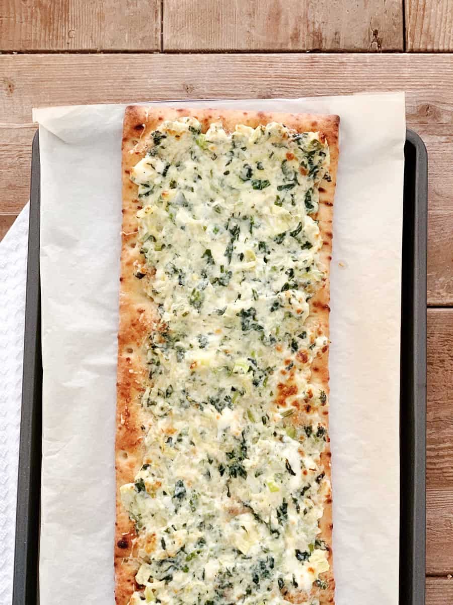 Turn your favorite dip into Spinach Artichoke Dip Pizza for a yummy dinner kids and adults will love! Pre-made crust makes this an easy weeknight meal!