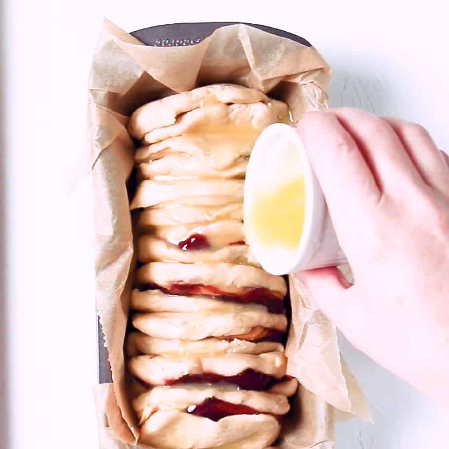 Making peanut butter and jelly pull apart bread.