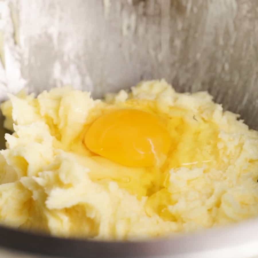 sugar, butter and eggs in a mixing bowl to make soft vanilla sugar cookies