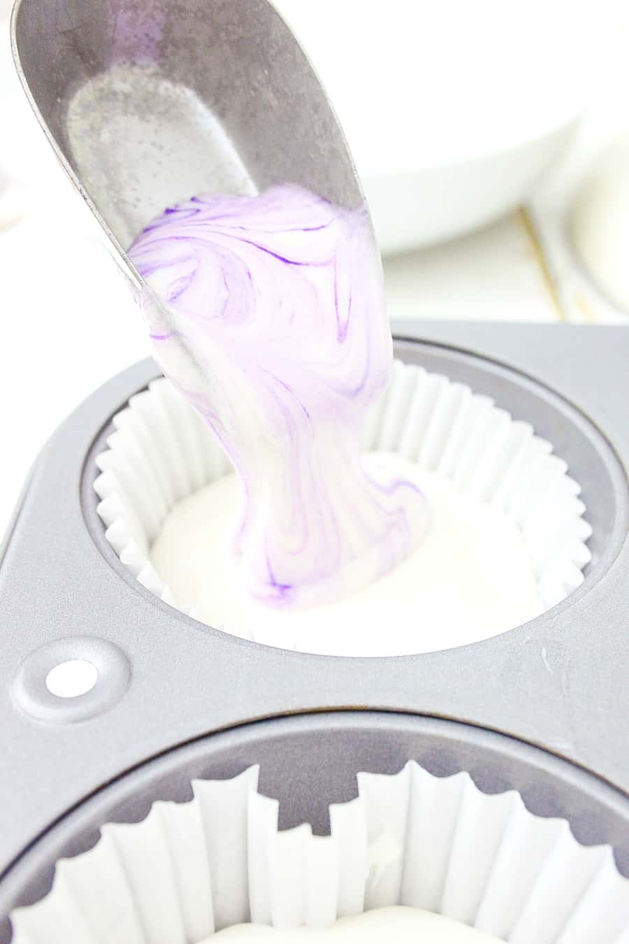 ghost cupcake batter poured in muffin tin