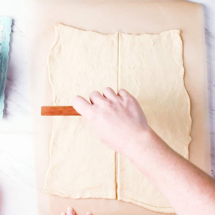 Ham and Broccoli Cheddar Cheese Bombs - cutting crescent dough