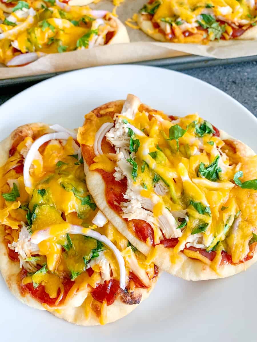 uplcose shot of two pieces of BBQ Chicken Naan Pizzas