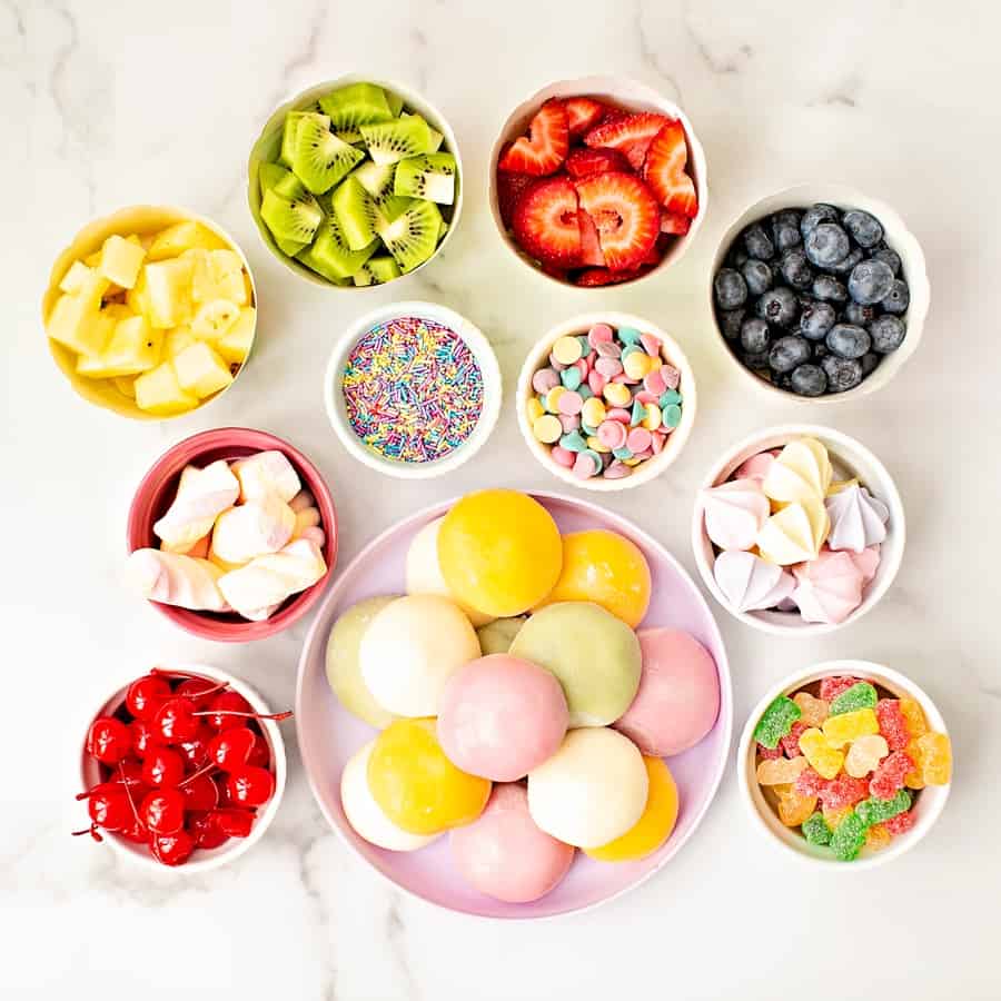 bowls of fruit, sprinkles and mochi ice cream