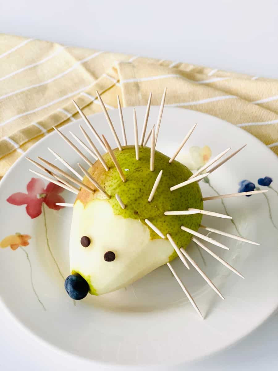 toothpicks inside a peeled pear to make a hedgehog