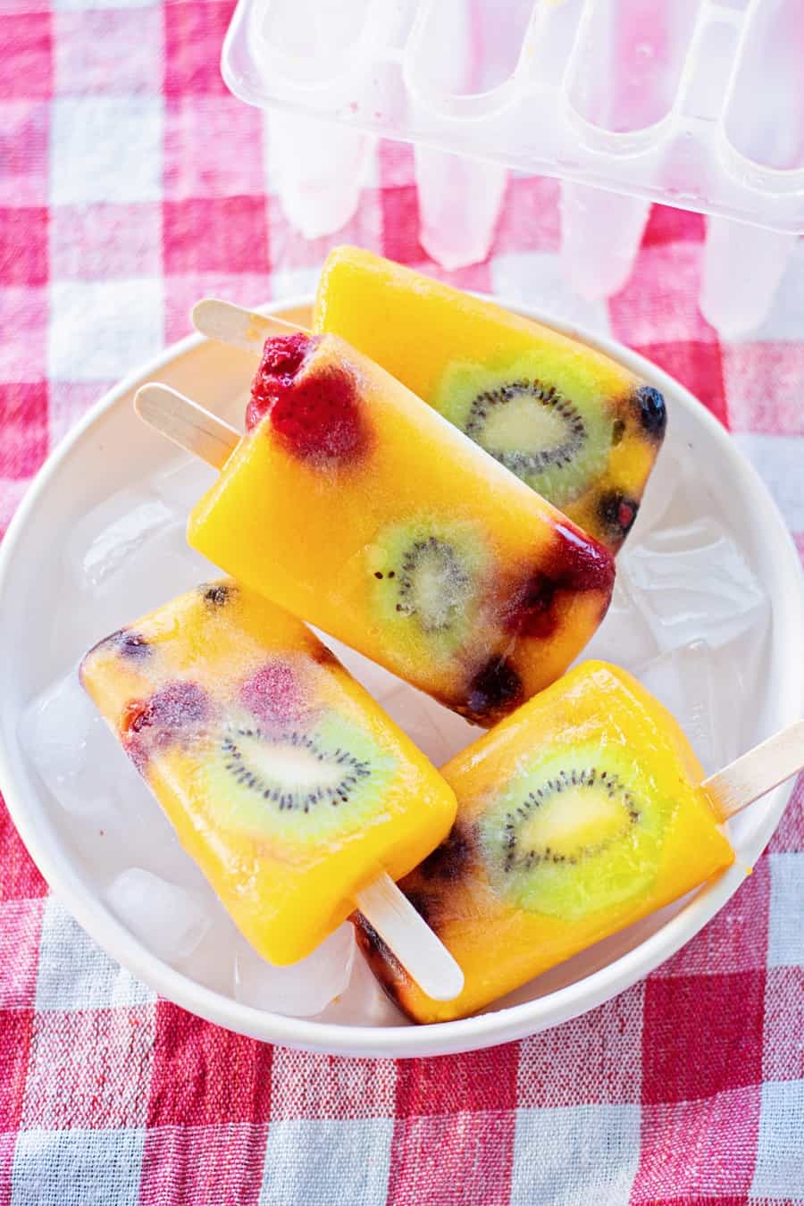 mango fruit popsicles with kiwi and berries