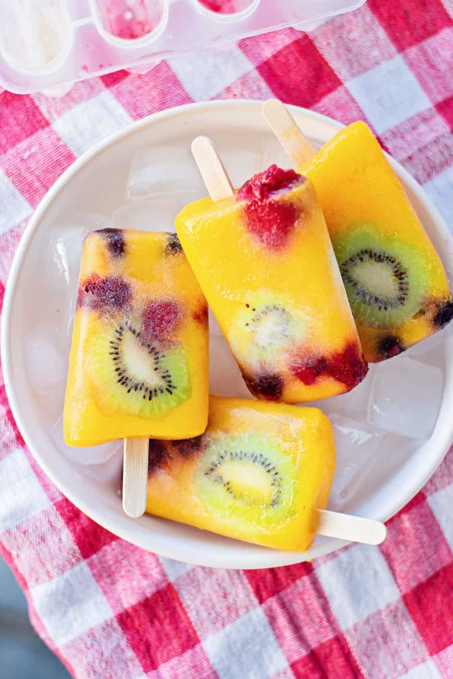 mango fruit popsicles with kiwi and berries