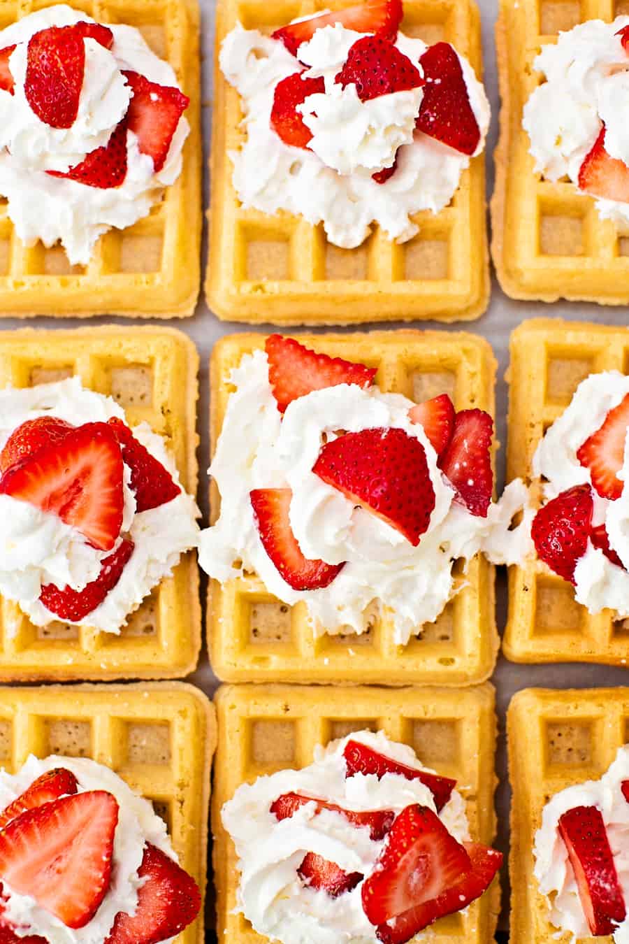 sheet pan waffles with whipped cream and strawberries