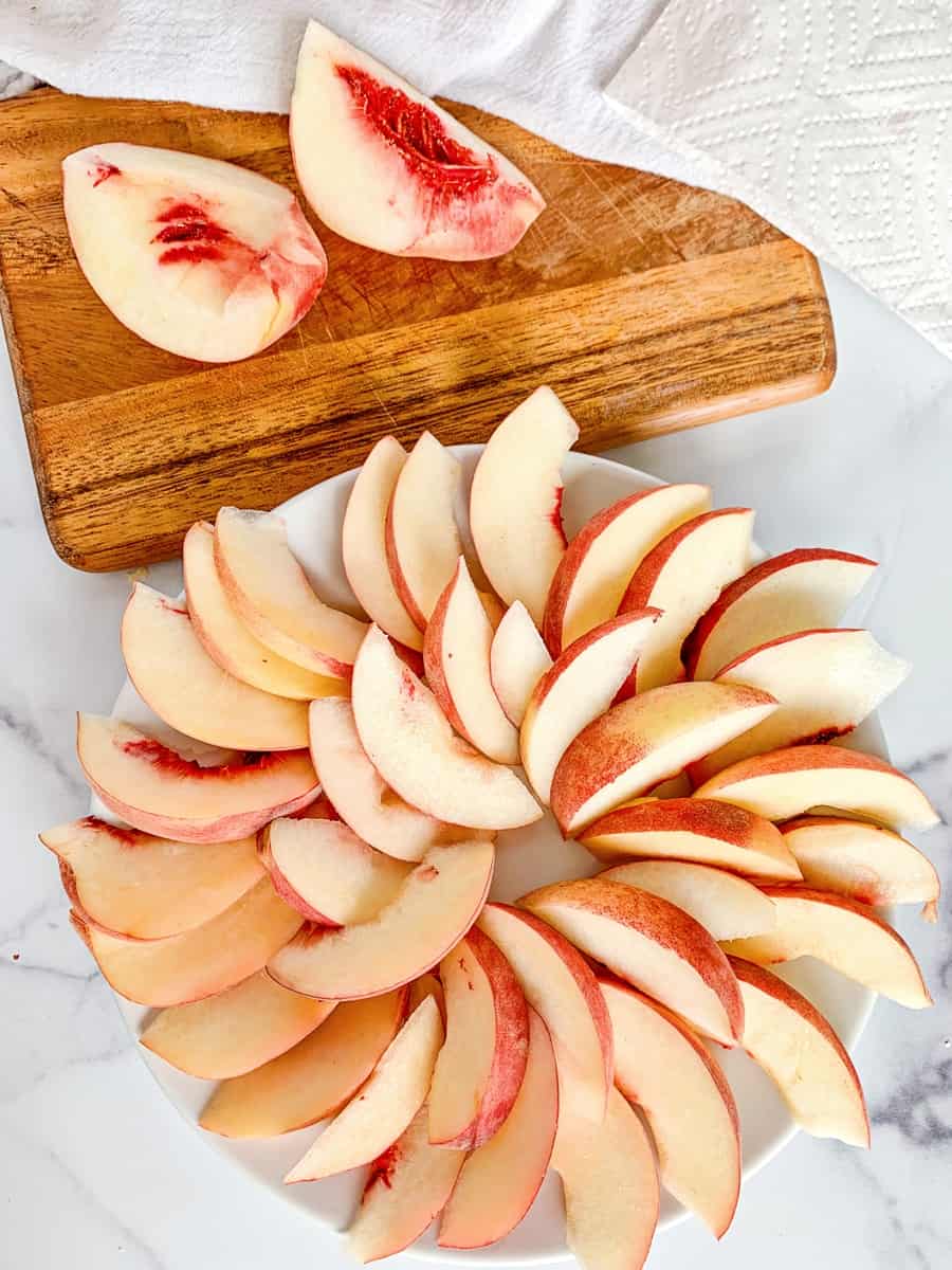 sliced peaches in a spiral to make fruit nachos