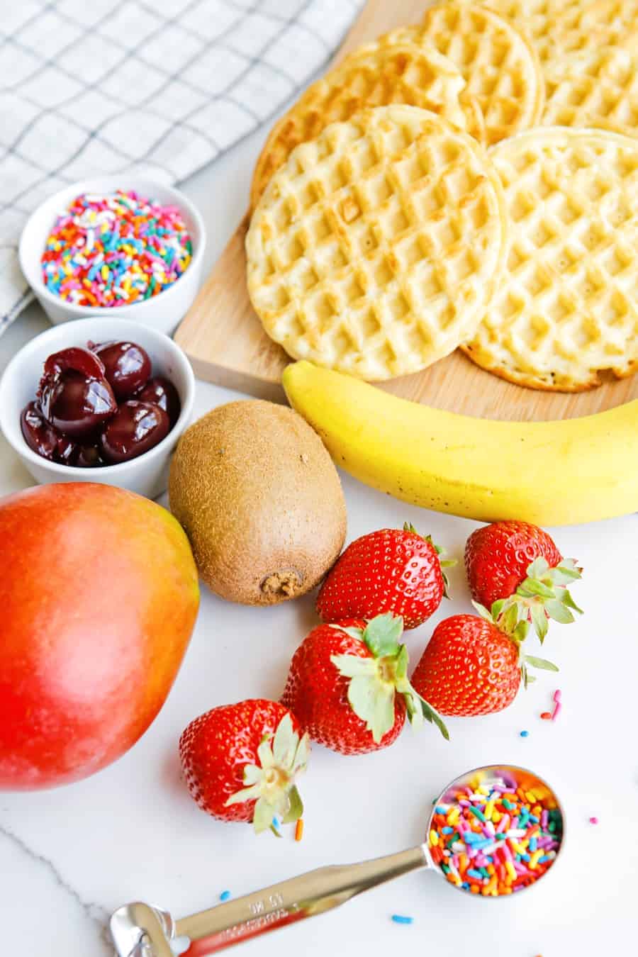 fresh fruit, sprinkles and waffle ingredients to make ice cream cone waffles