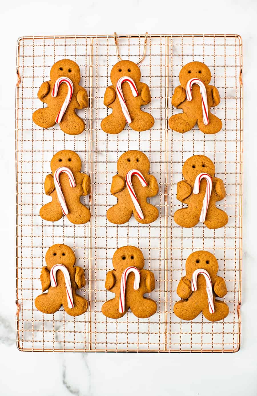 Gingerbread Holding Candy Canes Cookies