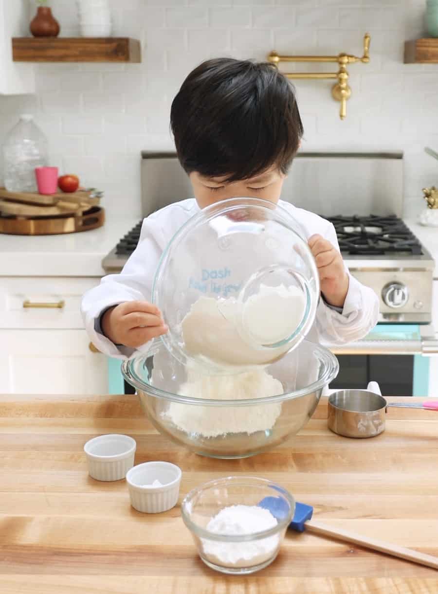 kids baking sprinkles cake