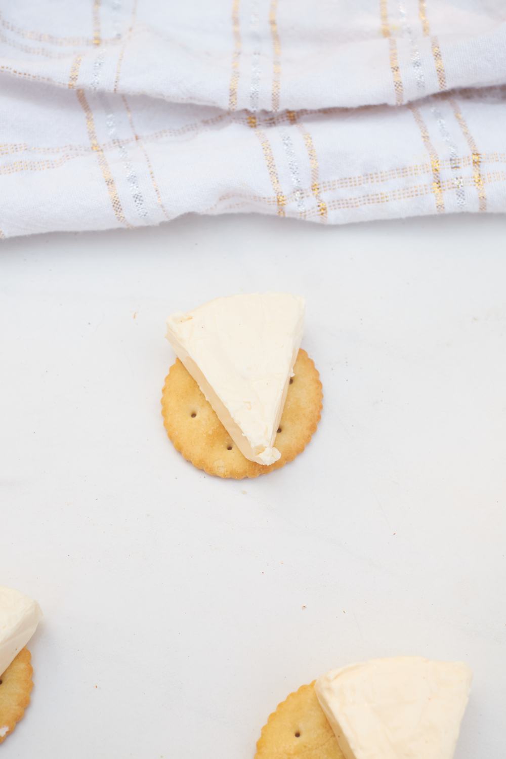triangle cheese on a cracker