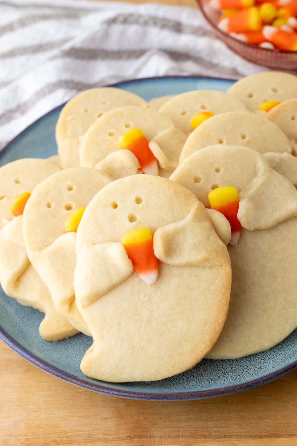 Shortbread Ghost Cookies Holding a Candy Corn