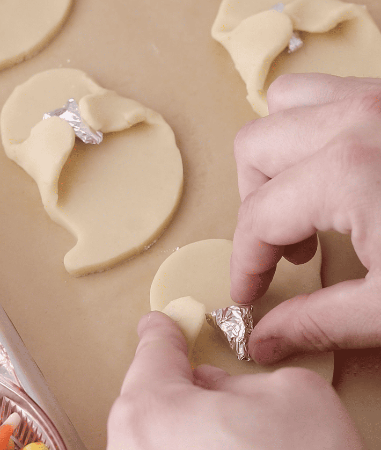 cutting out ghost cookies